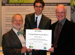 Professor Marian C. Horzinek presents the Young Scientist of the Year award 2010 to Williamn McEwan